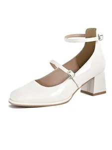 Elegant white patent leather Mary Jane shoes with square toe and chunky heels.