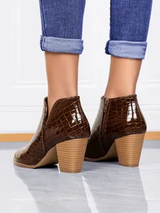Back view of brown crocodile embossed ankle boots with chunky heel and side zipper