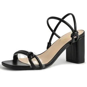 Side detail view of elegant black square toe block heel sandals with thin knotted straps