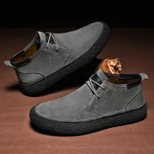 Premium grey suede men's mid-top casual boots with thick black textured rubber soles