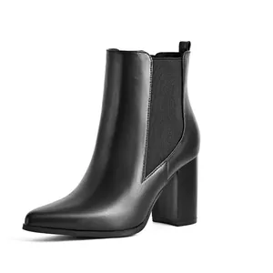 Elegant women's black pointed toe Chelsea ankle boots featuring a chunky high block heel