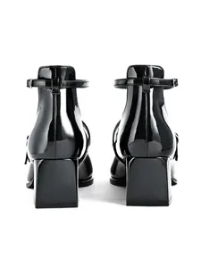 Detailed rear view of elegant black patent leather Mary Jane block heel party shoes