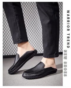 Detailed side view of premium black genuine leather men's loafers with soft sole