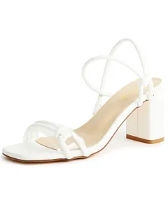 Detailed side view of elegant white square toe block heel sandals with thin straps.