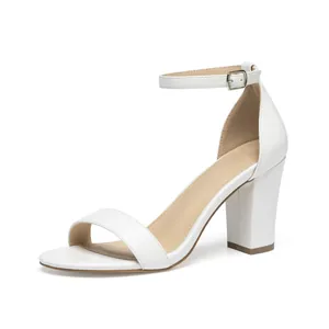 Detailed side view of elegant white block heel sandal with ankle strap and open toe