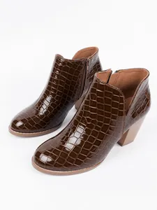 Side view of brown crocodile pattern ankle boots with chunky heel and side zipper