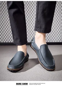 Detailed view of men's blue leather loafers with premium hand-stitched sole on feet