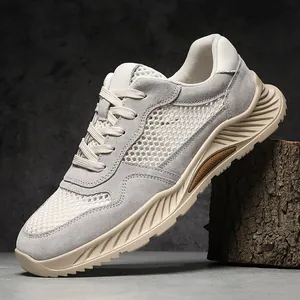 Ademende mesh en suède herensneakers met dikke golvende zolen