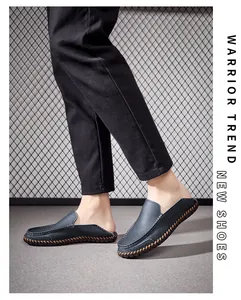 Detail view of men's blue genuine leather driving loafers with contrast hand-stitching