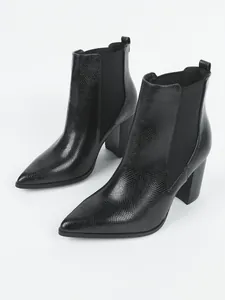 Detailed side view of black snake-skin embossed pointed-toe chunky heel boots