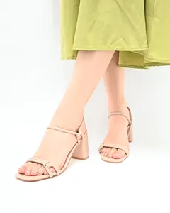 Close-up of nude block heel sandals with thin straps and square toe design