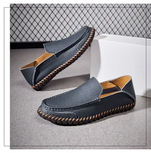 Detail of blue leather loafers featuring soft soles and premium hand-stitched texture.