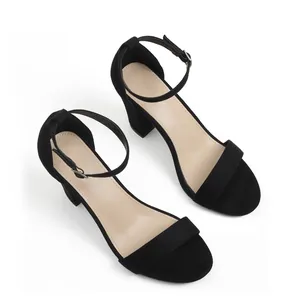 Elegant black suede chunky heel sandals with a minimalist ankle strap detail design