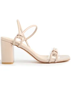 Elegant side view of beige chunky high heel sandals featuring chic knotted strap details.
