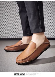 Detailed side view of brown leather loafers for men with high-quality textured finish