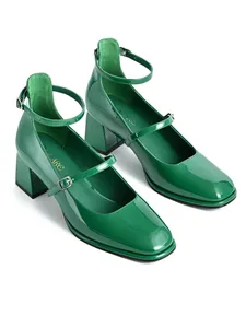 Detail view of green patent leather Mary Jane shoes with square toe and block heel