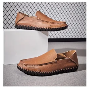 Close-up of brown leather men's loafers with detailed stitching and grain texture