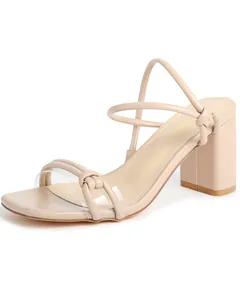 Elegant beige square toe block heel sandals featuring knot detail and transparent strap