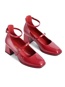 Detailed view of elegant red patent leather Mary Jane shoes featuring a square toe and block heel.