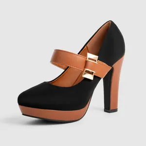 Detail view of stylish black and brown Mary Jane platform shoes with chunky high heels.