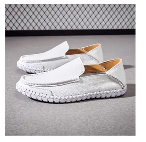White pebbled leather moccasins for men featuring a soft sole and contrast stitching
