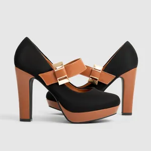 Elegant black suede Mary Jane platform heels featuring a brown chunky heel and gold buckle.