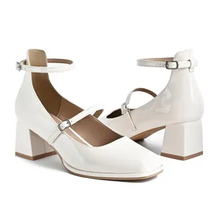 Elegant white patent leather Mary Jane shoes with square toe and block heel straps