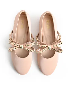 Detailed overhead view of nude pink ballet flats with golden studded bow and SICARE logo.