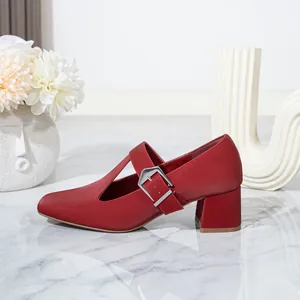 Side detail of red Mary Jane shoes with thick block heels and T-strap silver buckle