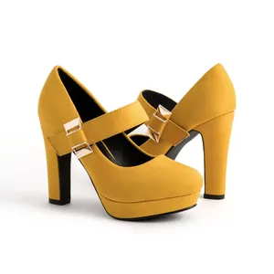 Detail of yellow suede Mary Jane platform heels with chunky heel and gold buckle ornament