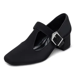 Elegant black Mary Jane shoes featuring a T-strap design and a stable chunky heel.