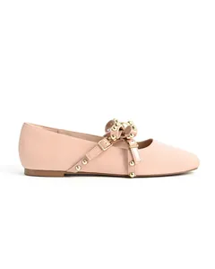 Elegant nude round-toe flats with decorative gold studs and stylish bow buckle detail.