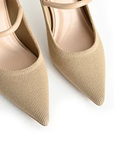Close-up detail of beige knitted pointed-toe Mary Jane pumps showing fabric texture