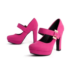 Close-up detail of hot pink suede Mary Jane platform high heels with gold buckles.