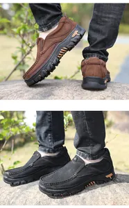 Dettaglio scarpe outdoor da uomo in pelle in marrone e nero con suole robuste.