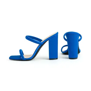 Elegant electric blue block heel sandals with square toe and minimalist two-strap design