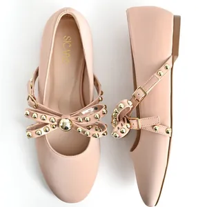 Elegant round-toe ballet flats with decorative studded bow and buckle strap in nude pink