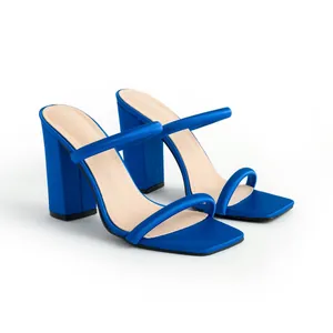 Vibrant electric blue satin sandals featuring a square toe and double straps on chunky heels
