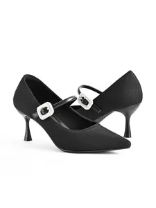 Side view of black pointed-toe Mary Jane heels with sparkly rhinestone buckle detail