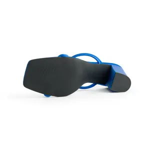 Detailed bottom view of blue square toe sandals showing black textured sole and block heel