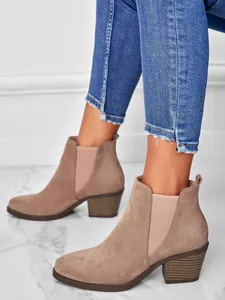 Detailed side view of suede pointed toe chunky heel ankle boots with elastic side