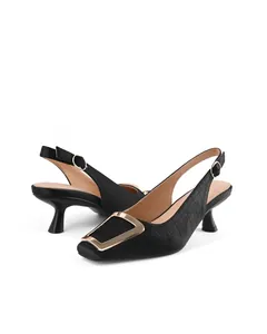 Elegant black textured slingback kitten heels with decorative gold square buckle detailing