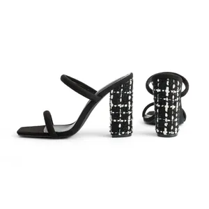 Detailed side view of square toe block heel sandals with elegant black and white tweed heels