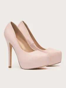 Side view detail of elegant pink suede platform stiletto pumps with a round toe design