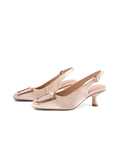 Close-up of elegant pink square-toe slingback heels with golden buckle and croc texture.