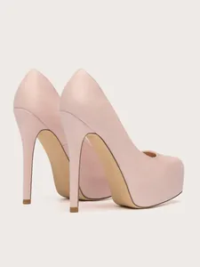Rear view of pink suede platform stiletto heels showing fine texture and extreme height