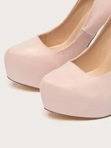 Detailed close-up showing the soft suede texture of pink round toe platform stiletto pumps