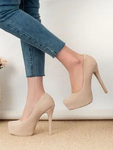 Elegant nude suede platform pumps with high stiletto heels shown in a side detail view.