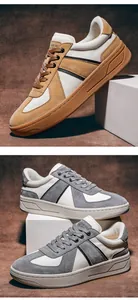 Vista dettagliata delle sneakers GAT da uomo con texture in camoscio nei colori beige e grigio.