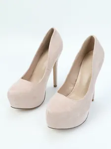 Detailed view of pink suede platform pumps with stiletto heels and round toe